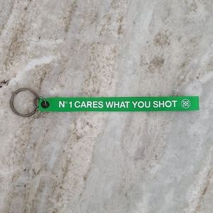 New G/Fore Keychain "N°1 Cares What You Shot"
